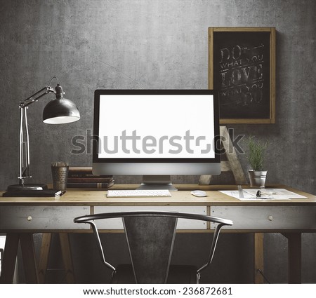 Stylish workspace with computer and posters on home or studio Stylish workspace with computer and posters on home or studio
