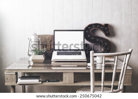 Stylish workspace with laptop  on home or studio