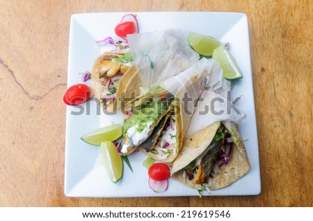 Three Fish Taco on white plate, view from above