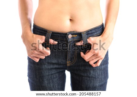 Jeans, Woman waist wearing jeans. Weight loss stomach closeup. Skinny jeans on a healthy slim fit body.