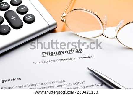 Contract about a nursing service on an outpatient basis with calculator, reading glasses and ballpoint pen, pflegevertrag