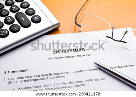 Contract about a nursing service on an outpatient basis with calculator, eyeglasses and ballpoint pen, Heimvertrag