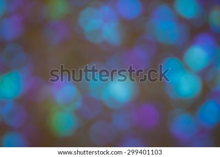 Blue and turquoise circles as an graphic, dark and blurred background texture