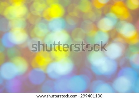 Multicolor circles as an graphic, bright and blurred background texture, yellow, blue