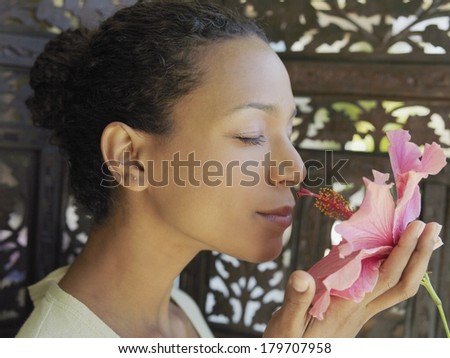 Beautiful black woman with a flower
