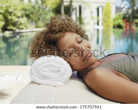 Beautiful black woman relaxing at spa