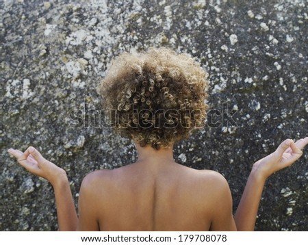 Beautiful black woman taking shower at spa