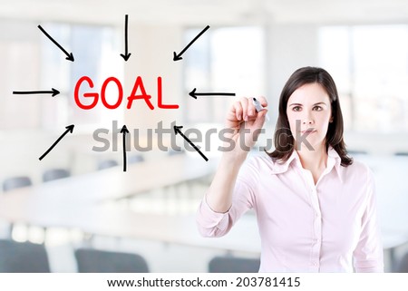 Young business woman access the goal. Office background.