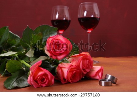 wedding ring, roses and red wine