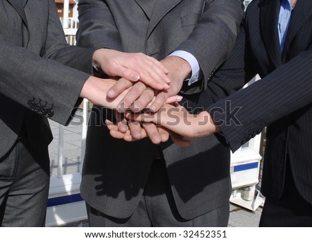 dynamic business-team - hands together