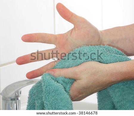 Drying hands using a towel