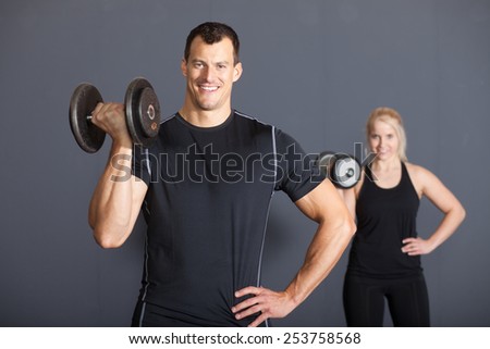 Fitness Team with a bar bell