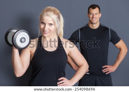 Fitness Team with a bar bell