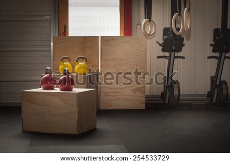colorful kettlebells on cross fit boxes