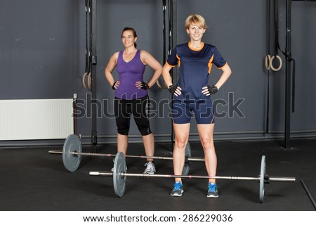 sports woman barbell training