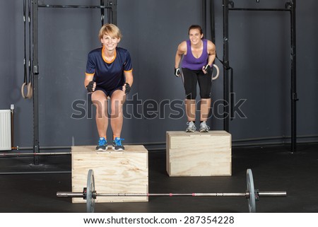 Woman fitness training - jump on a box