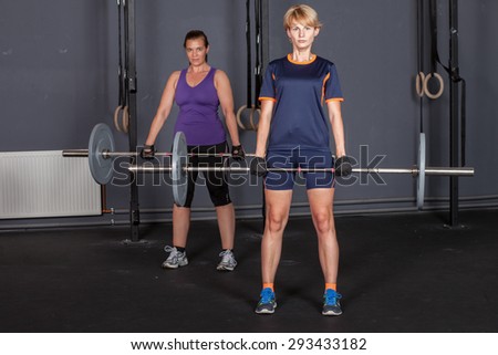 sports woman barbell training weight lifting