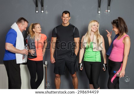 group of fitness people talking to each other