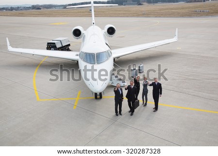 thumbs up - executive business team corporate jet