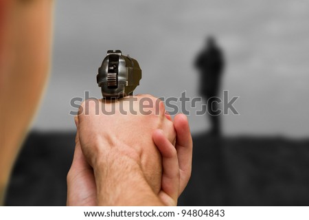 Man Pointing a Gun on People