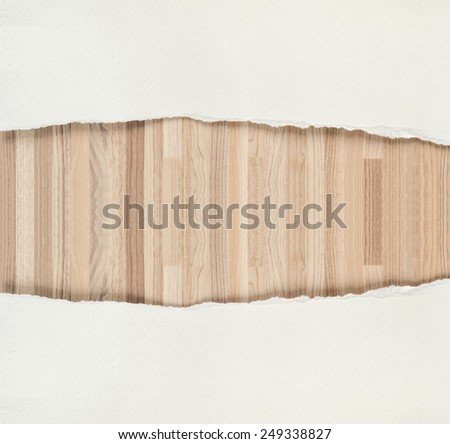 Ripped white paper texture and wooden texture background.