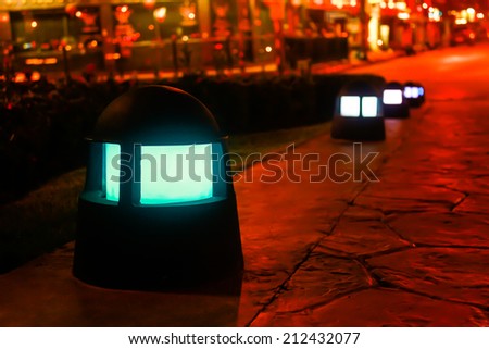Night picture of the lamp in the park. Decorative garden in the night.