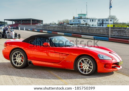 THRUXTON, HAMPSHIRE/UK - MARCH 20 : Side view of a Dodge Viper sports car at Thruxton racing circuit on March 20, 2009. Unidentified people.