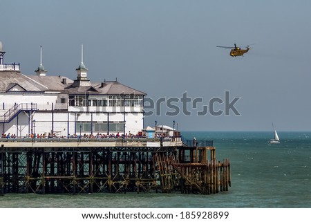 EASTBOURNE, EAST SUSSEX/UK - AUGUST 11 : Sea King HAR3 helicopter display at Airbourne in Eastbourne on August 11. Unidentified people.