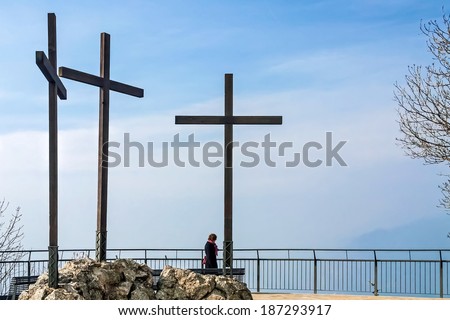 LAKE COMO, ITALY/EUROPE - FEBRUARY 21 : Three crosses at the Volta Lighthouse overlook at Lake Como in Italy on February 21, 2008. Unidentified woman.