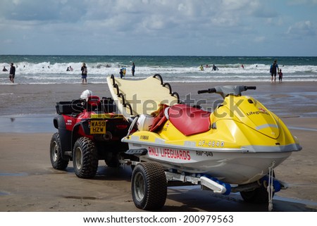 BUDE, CORNWALL, UK - AUGUST 12 : RNLI Lifeguards on duty at Bude in Cornwall on August 12, 2013. Unidentified people.