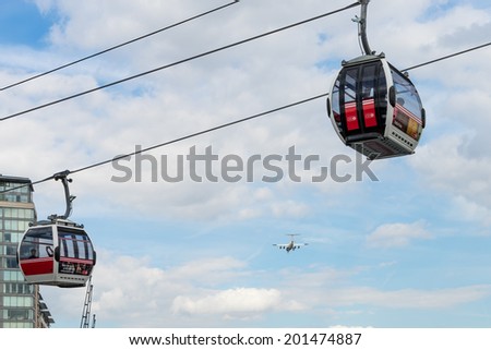 LONDON - JUNE 25 : View of the London cable car over the River Thames in London on June 25, 2014. Unidentified people.