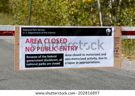 JACKSON HOLE, WYOMING/USA - OCTOBER 1 : US National Parks closure sign at entrance to the Grand Tetons National Park in Wyoming on October 1, 2013