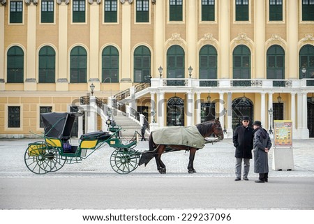 VIENNA, AUSTRIA/EUROPE - SEPTEMBER 23 : Horse and carriage at the Schonbrunn Palace in Vienna Austria on September 23, 2014. Unidentified people.