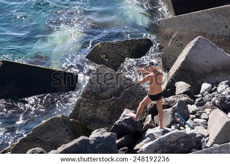 SAN JUAN, TENERIFE/SPAIN - JANUARY 18, 2015 : Man fishing in San Juan Tenerife Spain on January 18, 2015. Unidentified man