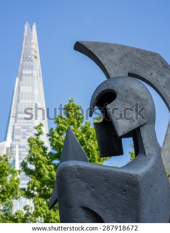 LONDON - JUNE 10 : Warrior sculpture in front of the Shard in London on June 10, 2015