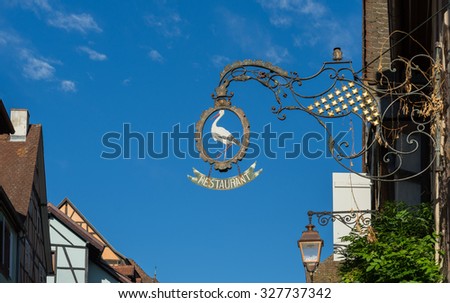 RIQUEWIHR, FRANCE/ EUROPE - SEPTEMBER 24: Hanging sign in Riquewihr in Haut-Rhin Alsace France on September 24, 2015