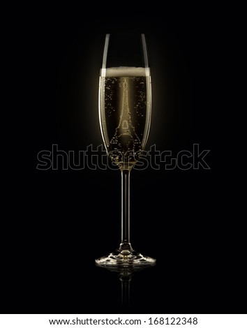 Glass of champagne with Eiffel Tower on black background