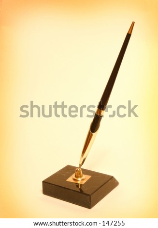Photo of a pen in a stand.