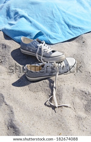 Sport footwear on sand.