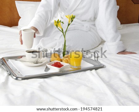 Breakfast in bed in hotel room.