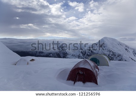 Evening in the high-altitude mountaineering camp. North face of Khan Tengri peak, Camp 2 (5500 m), Tian Shan mountains, Central Asia, Kazakhstan