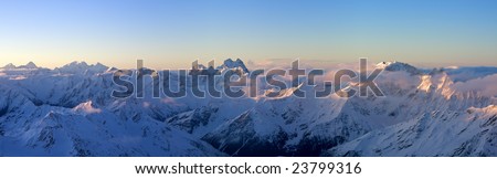 Panorama of Greater Caucasus in sunrise from Mt.Elbrus. Caucasus Mountains, Russia