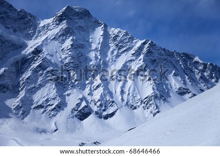 Snow avalanche on mountainside of Mt. Donguz-Orun, Caucasus mountains, Russia