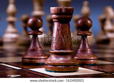 Chess on the dark background.