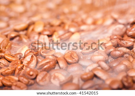 fragrant fried coffee beans with smoke