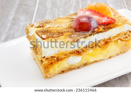 Cake fruit over Cream Golden baked and base of pastry.
