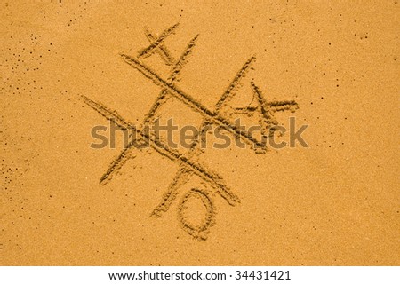 X and O game on the sand
