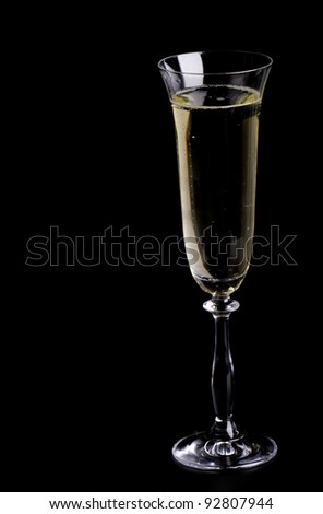 a glass  champagne on the black