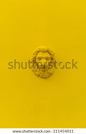 Lion head with yellow wall