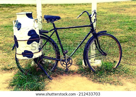 bicycle with steel milk container at the back